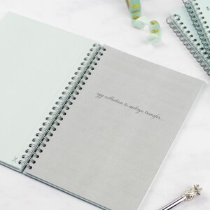 The ivf planner open at one of the section divider pages, this page is the beginning of the egg collection to embryo transfer section.