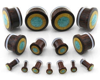May include: Set of wooden ear gauges with turquoise and gold inlay. The gauges are available in various sizes.