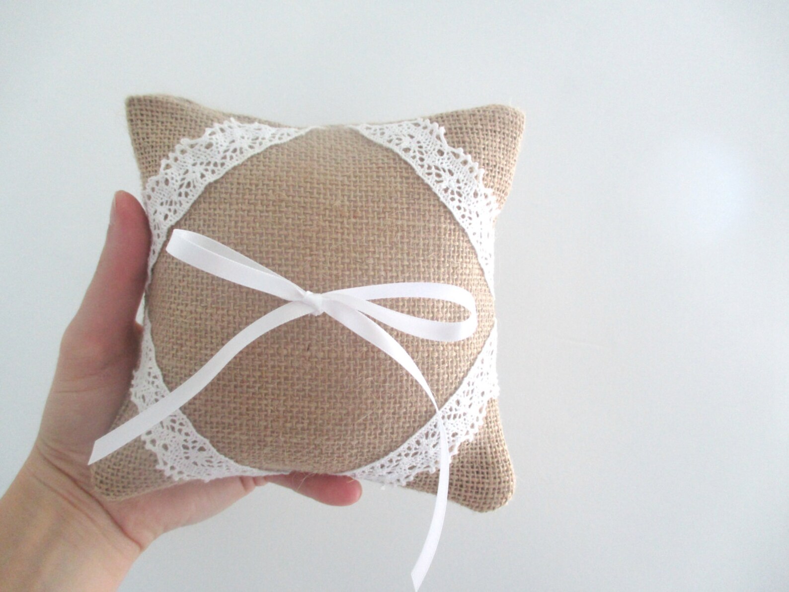 Handmade rustic chic wedding ring cushion in burlap with