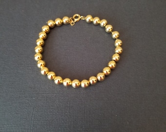 Gold Bead Bracelet - Bracelet of 27 small Beads that may be Gold, GF, or bright Gold tone