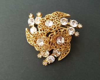 Rhinestone Dome Brooch -Large Gold tone Dome in Flower pattern with 12 large faceted Rhinestones, and 6 small Rhinestones