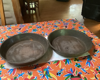 Vintage pair of farmhouse, metal grain sieves, flour sifters, or strainers from the 1930s