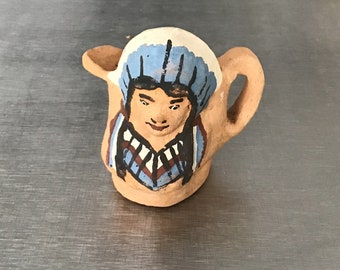 Vintage Crude terra cotta small creamer or Toby jug with Native American design