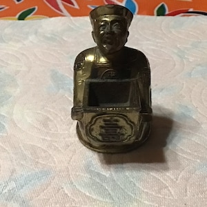 Vintage brass seated Asian man incense burner