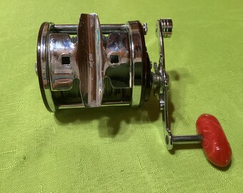 Moulinet de pêche Penn Jigmaster années 500 bobine rouge