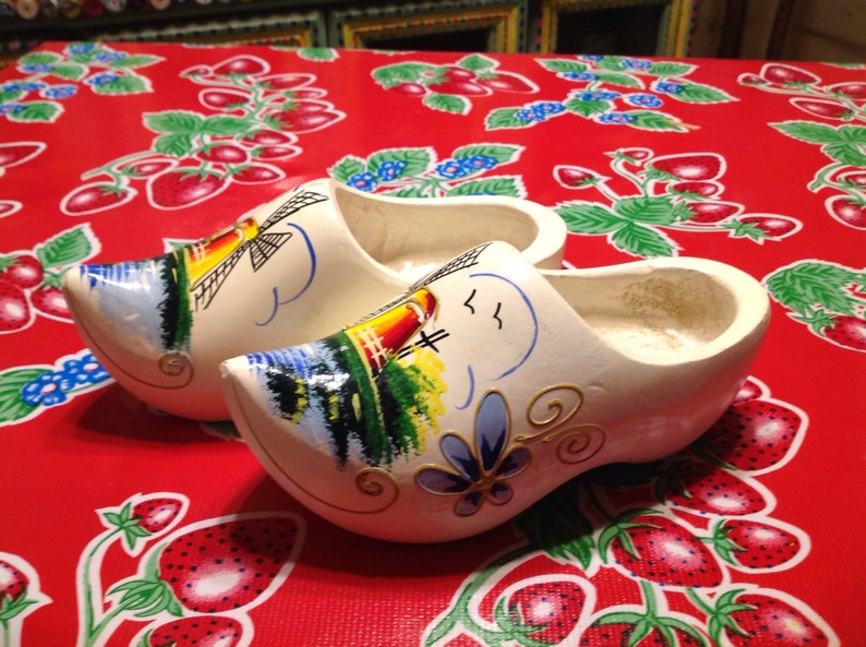 Vintage white Dutch wooden shoes with hand painted windmill designs