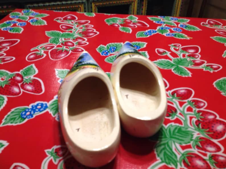 Vintage white Dutch wooden shoes with hand painted windmill designs