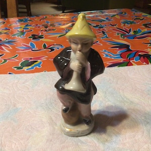 Vintage hand painted Asian man figurine blowing a horn- Occupied Japan