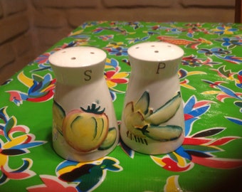 Vintage ceramic pair of hand painted salt and pepper shakers with vegetable designs