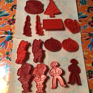 Vintage set of 21 assorted red Tupperware plastic  cookie cutters- USA- sold separately