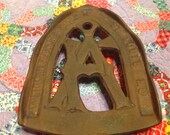 Vintage cast iron American Foundry sad iron rest, holder, or trivet- St. Louis, Mo.