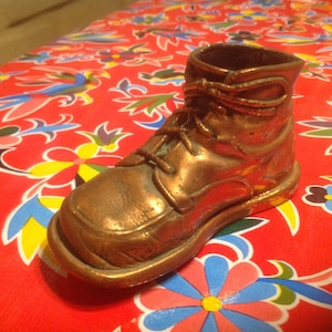 Vintage bronzed baby shoe
