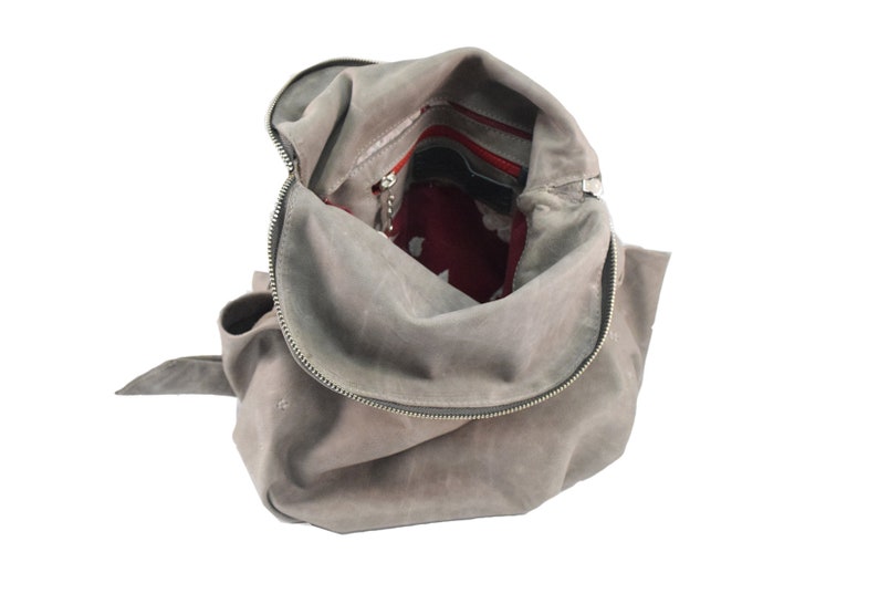Light gray zipped leather backpack