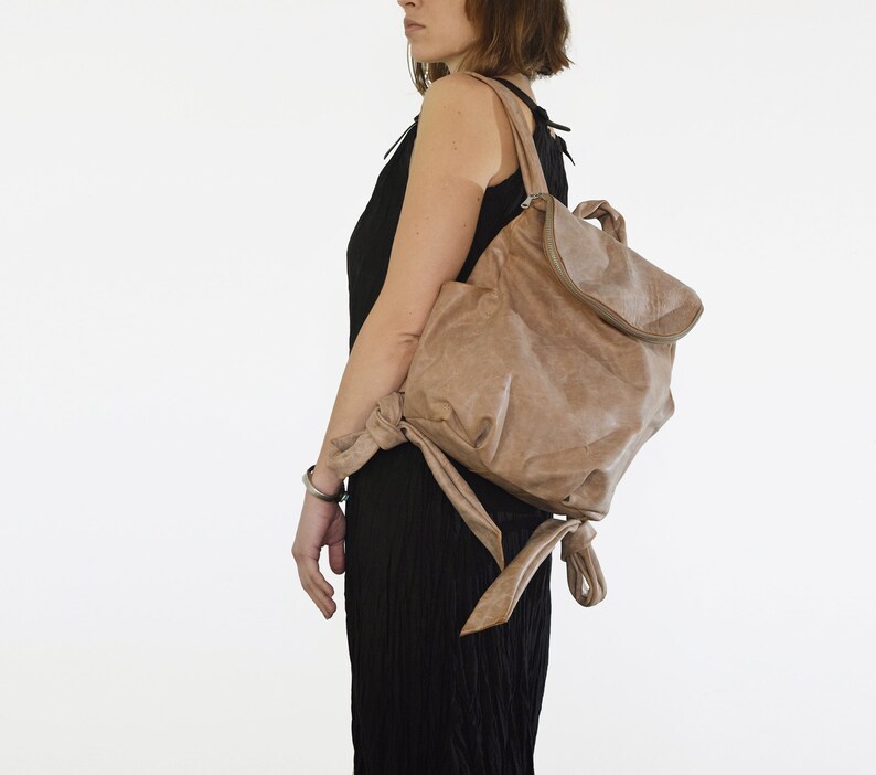 Light gray zipped leather backpack