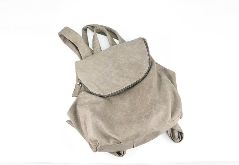 Light gray zipped leather backpack