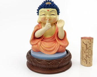 Vintage Smiling Shakyamuni Buddha Figurine: Blue Hair Lotus Seat Clay Resin Statue