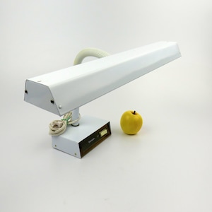May include: White metal desk lamp with a flexible arm and a rectangular light fixture. The lamp has a brown base with a switch and the text "Sunbeam" on it.