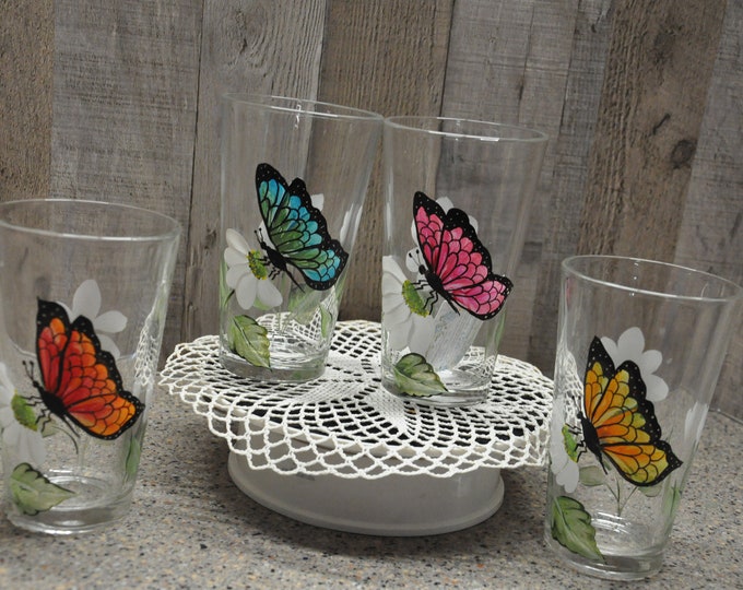 Hand painted,  butterfly and daisy drinking glasses