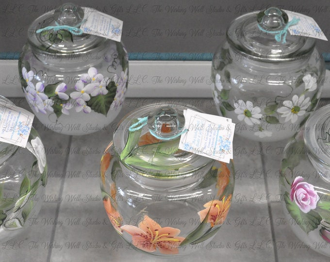 Hand painted floral pot belly canister.