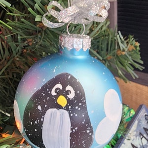 Single, hand painted Penguin ornament Lt. Blue