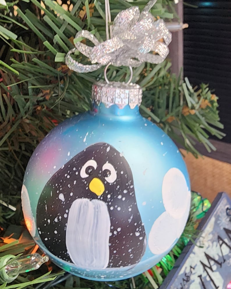 Single, hand painted Penguin ornament Lt. Blue