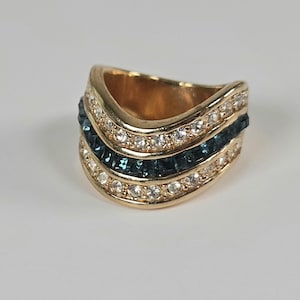 May include: A set of three ceramic mugs with a speckled, matte finish. The mugs are in shades of cream, light gray, and dark gray. Each mug has a simple, minimalist design and a rounded handle.