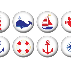 May include: Eight nautical themed buttons with white backgrounds and red, blue, and yellow accents. The buttons feature a lighthouse, whale, sailboat, crab, anchor, life preserver, anchor, and compass.
