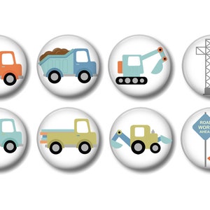 May include: Set of 8 construction vehicle themed buttons. The buttons feature a cement mixer, dump truck, excavator, crane, pickup truck, backhoe, and a road work sign with a cone.