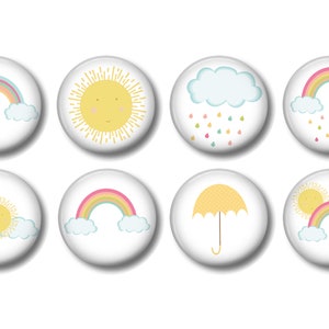 May include: Set of eight colorful weather themed buttons with various images including a sun, rainbow, clouds, rain, and an umbrella.