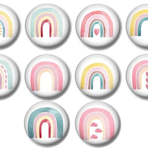May include: Set of 10 watercolor rainbow magnets with various designs, including hearts, dots, and swirls. The rainbows are in shades of pink, yellow, blue, and brown.