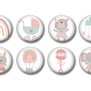 May include: Set of eight 1.5 inch round baby shower buttons with various designs. The designs include a rainbow, a baby carriage, a bear, a cloud with stars, a bunny, a hot air balloon, a rattle, and an elephant. All of the designs are in pink, blue, and gray.