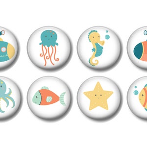 May include: Eight colorful round buttons with different sea creatures and a submarine. The buttons feature a blue octopus, a yellow starfish, a blue and orange fish, a blue and orange submarine, a blue jellyfish, a yellow seahorse, a blue and orange fish, and a red and blue submarine.