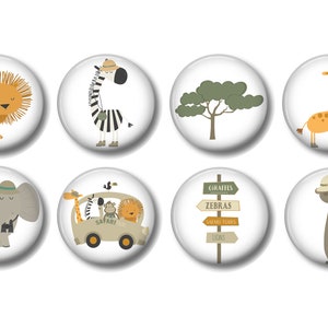 May include: Set of eight safari animal themed round buttons. The buttons feature a lion, zebra, tree, giraffe, elephant, safari jeep with animals, a signpost with safari animal destinations, and a meerkat.