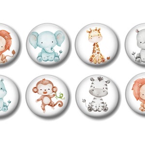 May include: Set of eight watercolor animal magnets featuring a lion, elephant, giraffe, rhinoceros, hippopotamus, monkey, zebra, and lion. The magnets are round and have a white background.
