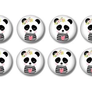 May include: Eight round white buttons with a black and white panda bear wearing a pink heart and a flower crown. The panda bears are all smiling.