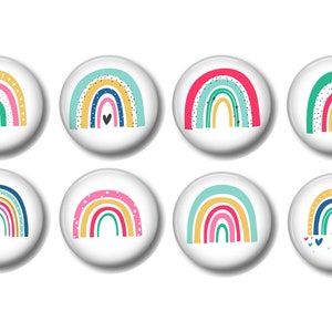 May include: Set of eight colorful rainbow buttons with different patterns and designs. Each button features a rainbow with a white background.
