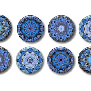 May include: Eight blue and white mandala-style round buttons with intricate designs. The buttons have a glossy finish and are perfect for adding a touch of whimsy to any project.