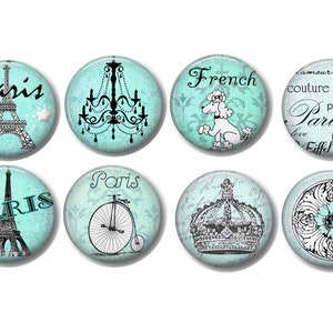 May include: Eight round, turquoise blue, decorative buttons with black and white images. The images include the Eiffel Tower, a chandelier, a poodle, a crown, a bicycle, and a floral design. The buttons have the words "Paris", "French", "love", and "Eiffel Tower" on them.