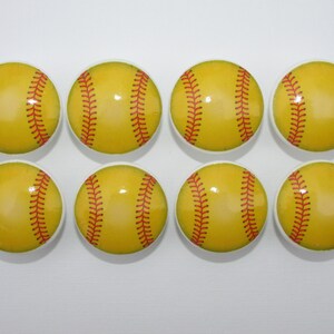 May include: Eight yellow and red softball-themed cabinet knobs.