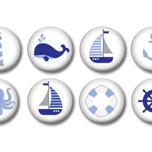May include: Eight blue and white nautical themed buttons with various images including a lighthouse, whale, sailboat, anchor, octopus, life preserver, and ship's wheel.