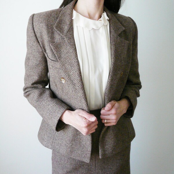 Vintage brown tweed suit. Size 4. Tapered jacket and knee high skirt with subtle flare. Made in Great Britain. Sheridan Barnett.