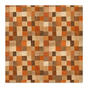 May include: A square textile featuring a repeating grid pattern of solid and textured squares in shades of burnt orange, tan, cream, and dark brown. Some squares contain fine horizontal or vertical line details, while others are solid colors.