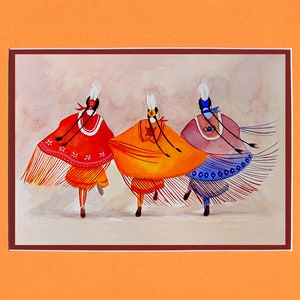May include: Three women in colorful traditional Native American dress dance in a circle. The women are wearing red, orange, and purple dresses with white fringe. They are also wearing white headbands with feathers.