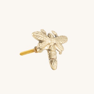 May include: Gold metal dragonfly drawer pull with a screw.