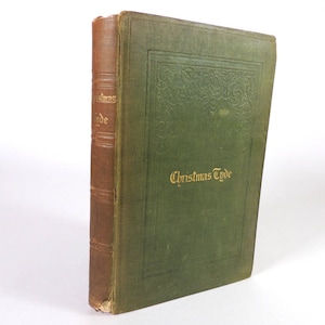 May include: A vintage green hardcover book with gold lettering on the spine and front cover that reads "Christmas Tyde".