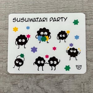 May include: A white sticker featuring the text "SUSUWATARI PARTY" and illustrations of soot sprites. The sprites are black with white eyes and are holding colorful star-shaped objects. Additional stars in yellow, pink, green, and blue are scattered around.
