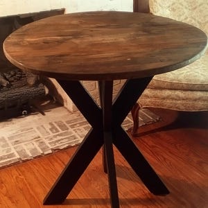Handmade round farmhouse table made from reclaimed pallet wood