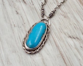 Blue Basin Kingman Turquoise Gemstone Pendant with Handmade Twisted Wire Trim, Silver Bali Beads and Sterling Silver Chain