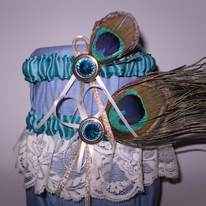 Teal, ivory and gold garter set with teal crystals and peacock feathers