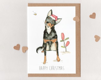 FELIZ NAVIDAD. Tarjeta. Kelpie australiano. Abeja osito de peluche. Perro de trabajo. Kelpie negro y marrón. Australia
